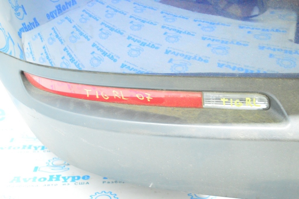 Отражатель заднего бампера лев VW Tiguan 09-17 (деф) 3 усика обломано